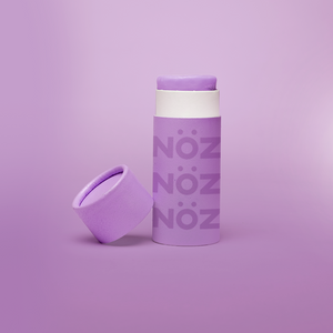 Nöz’s reef safe, Zinc oxide, & colorful sunscreen in purple.