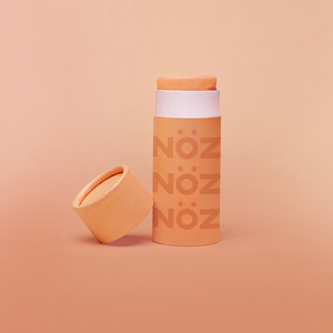 Nöz’s reef safe, Zinc oxide, & colorful sunscreen in orange.